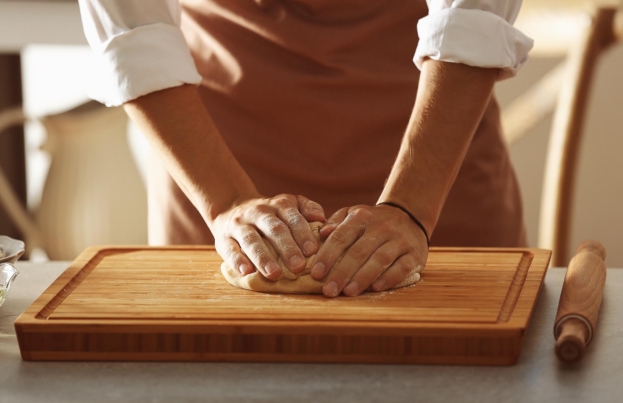Detail of hands preparing pastry